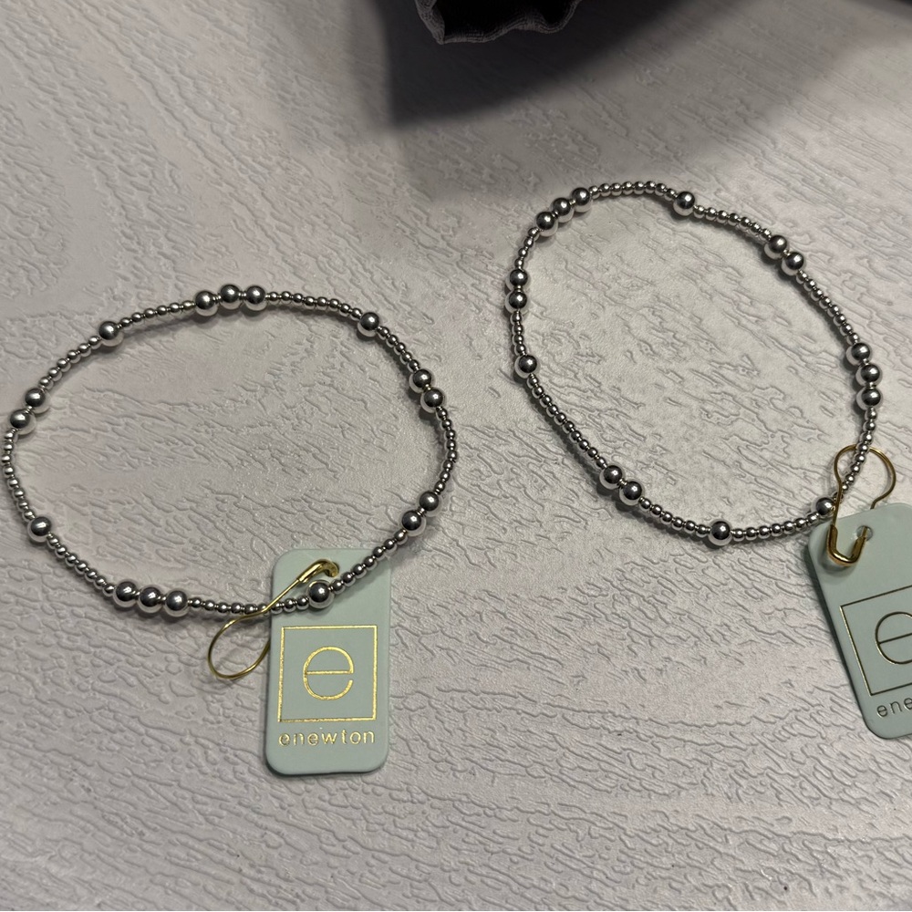 2 ENewton Hope Unwritten bracelets